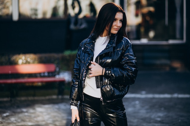 Young pretty woman in warm jacket outdoors