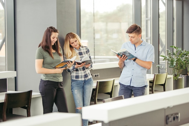 Young readers standing in library