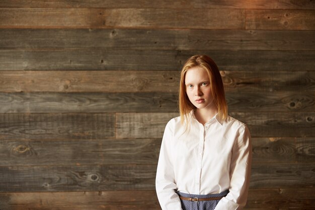 Young red-haired woman in cafe