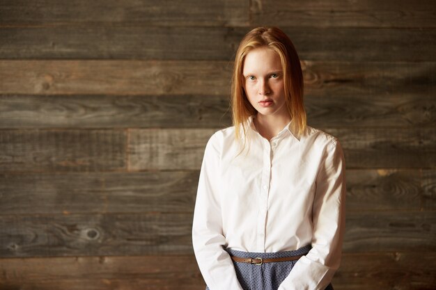 Young red-haired woman in cafe