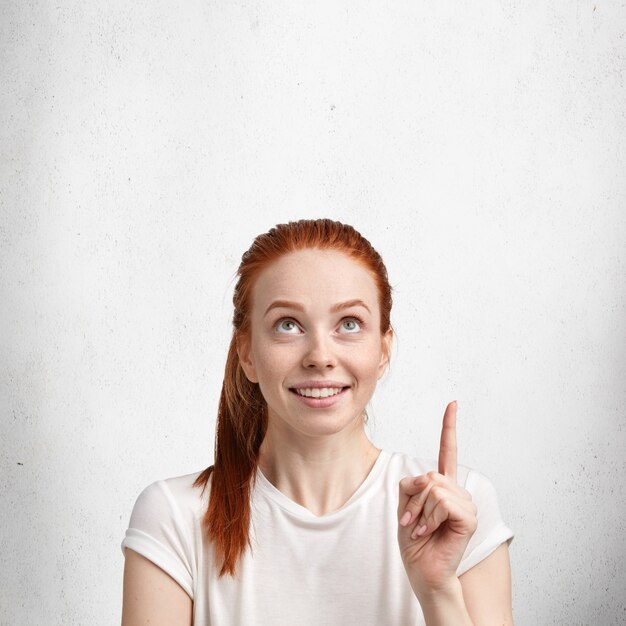 Young red-haired woman with white T-shirt