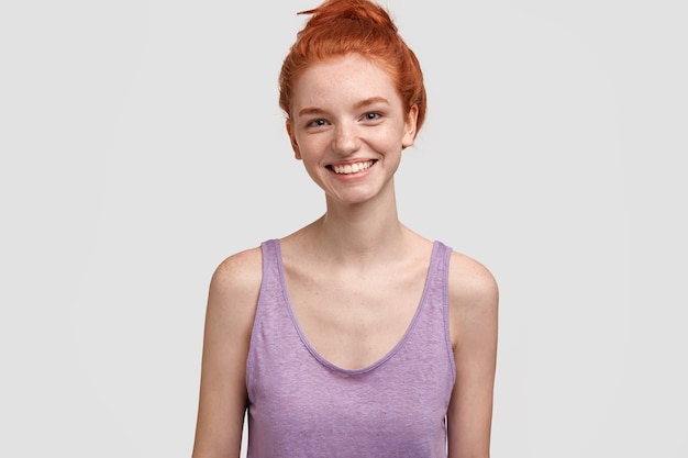 Young red-headed woman in purple top