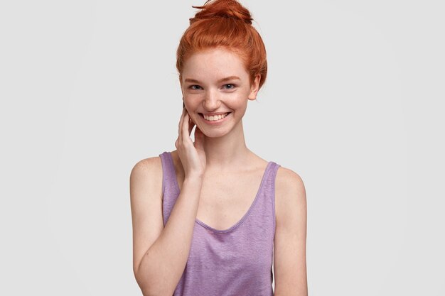 Young red-headed woman in purple top