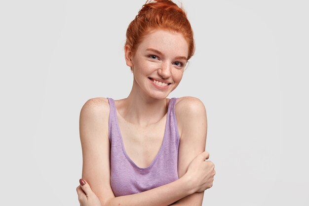 Young red-headed woman in purple top