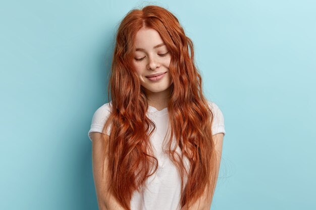 Young redhead girl with wavy hair