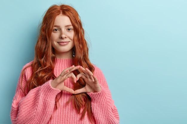 Young redhead girl with wavy hair