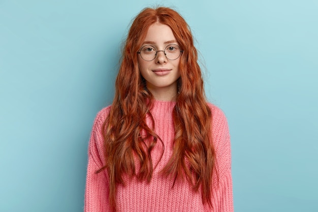 Free photo young redhead girl with wavy hair