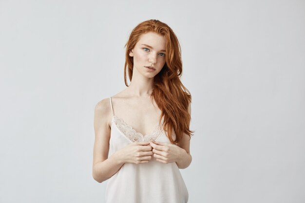 Young redhead woman posing.