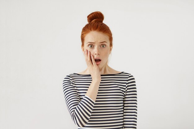 Young redhead woman posing