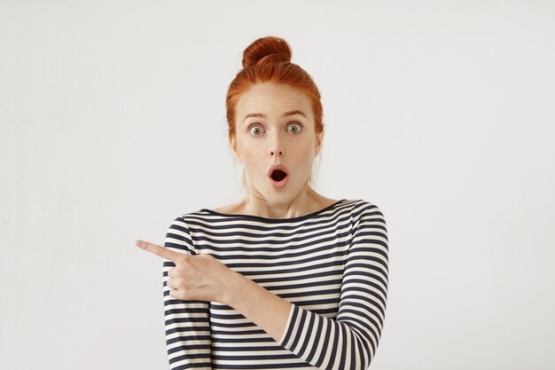 Young redhead woman posing