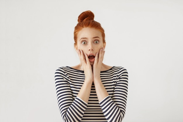 Young redhead woman posing