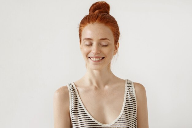 Young redhead woman posing