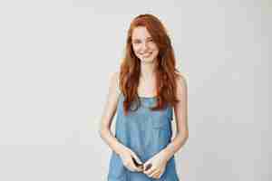 Free photo young redhead woman smiling.