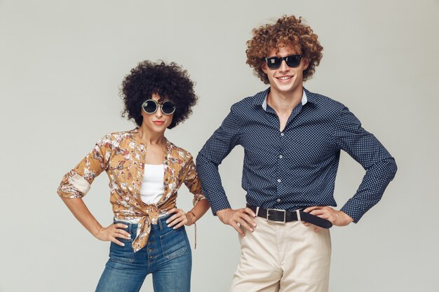 Young retro loving couple posing isolated