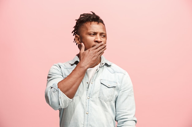 Young serious thoughtful Afro-American businessman. Doubt concept.