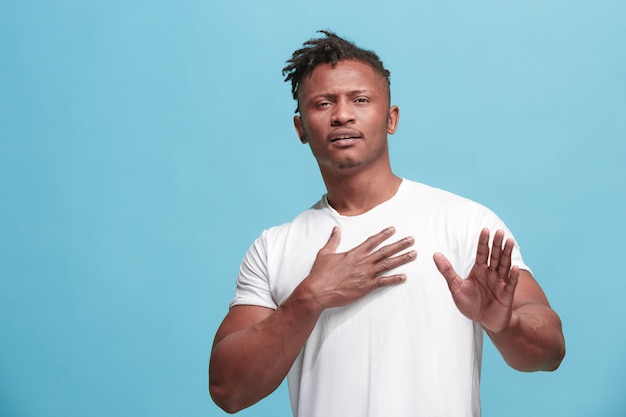 Free photo young serious thoughtful afro-american businessman. doubt concept.