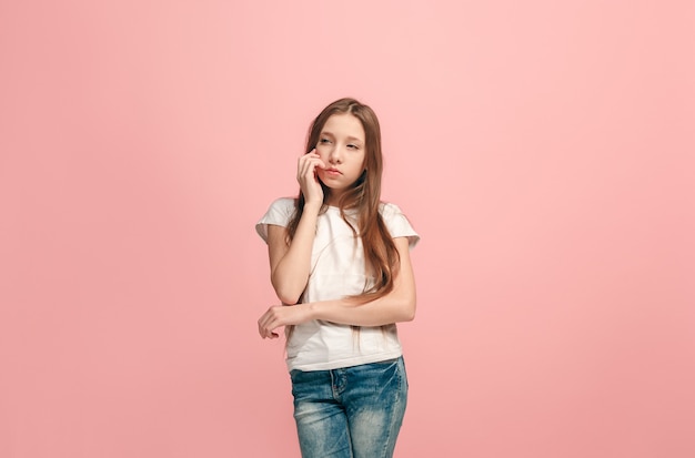 Free photo young serious thoughtful teen girl doubt concept