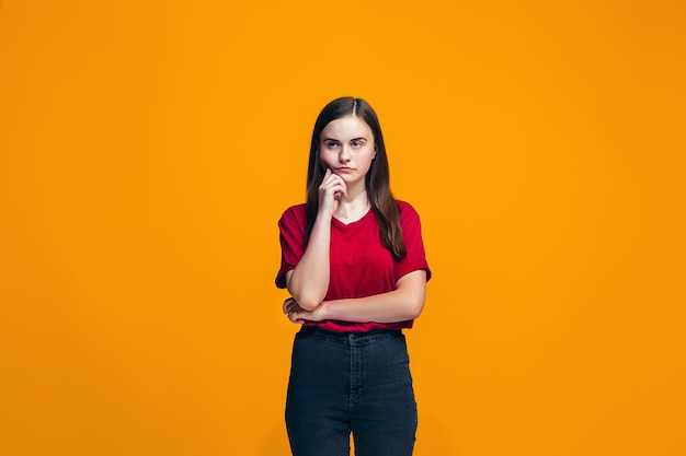 Young serious thoughtful teen girl. doubt concept.