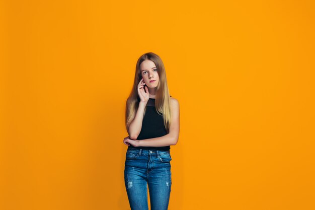 Young serious thoughtful teen girl. Doubt concept.