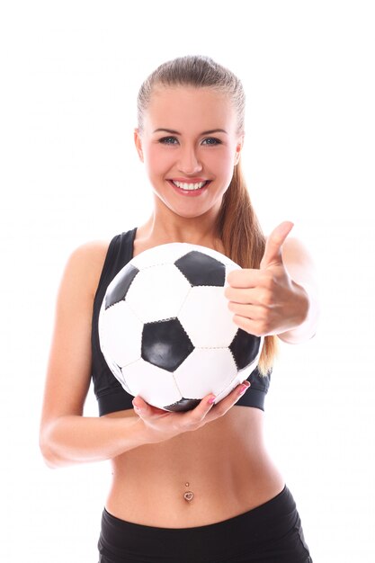 Young and sexy girl with soccer ball