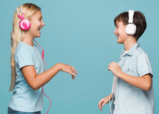 Free photo young siblings listening music