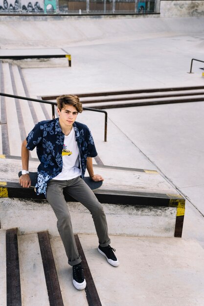 Young skater boy posing