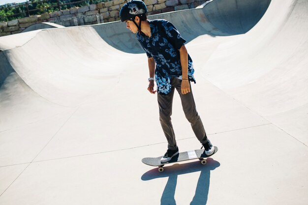 Young skater training with helmet