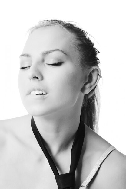 Young slim woman wearing bra on white background