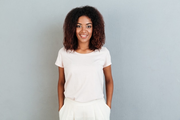 Young smiling afro american woman standing
