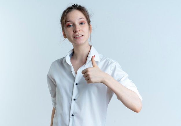 Young smiling blonde russian girl thumbs up isolated on white space with copy space