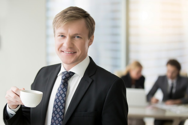 Free photo young smiling businessman