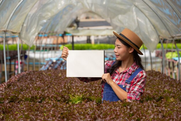 The young smiling farmer stood empty white paper.