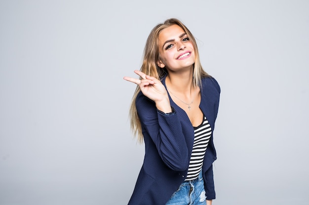 Young smiling woman showing victory or peace sign isolated