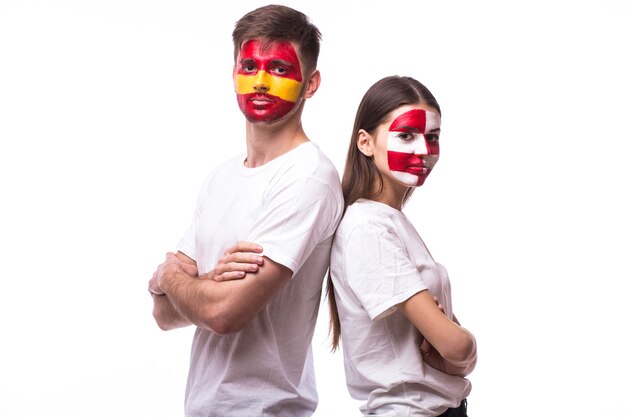 Young spanish and croatian football fan isolated on white wall