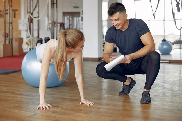 Young sports people training in a morning gym