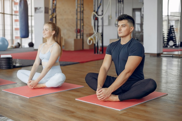 Young sports people training in a morning gym