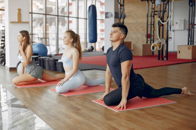 Young sports people training in a morning gym