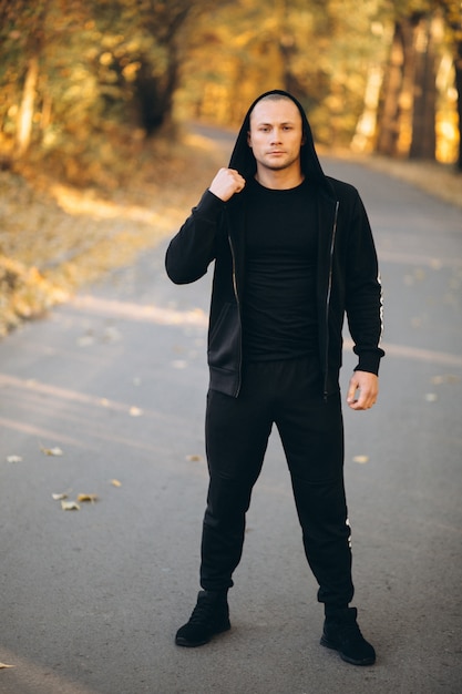 Young sportsman exercising in park