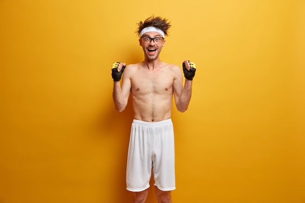 Young sportsman getting ready for his training isolated