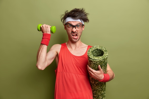 Free photo young sportsman getting ready for his training isolated