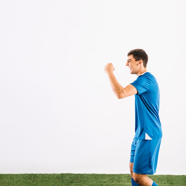 Free photo young sportsman running and celebrating victory