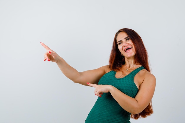 Young sporty woman in a green bodycon