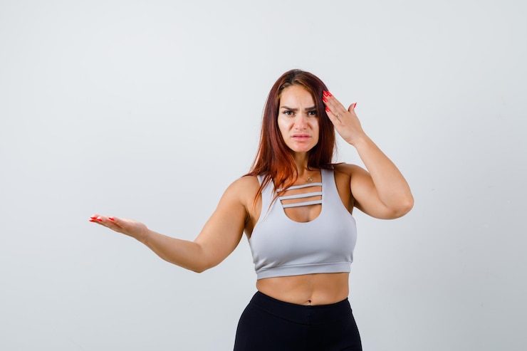Free Photo young sporty woman with long hair in a gray top