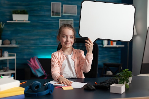 Free photo young student holding blank white board sign