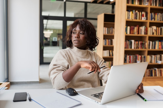 Young student learning in the library