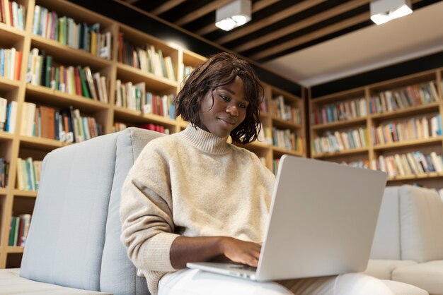 Young student learning in the library