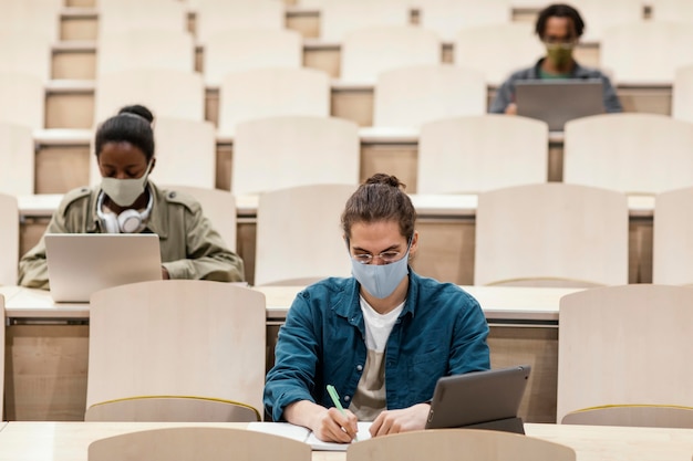 Free photo young students attending a class