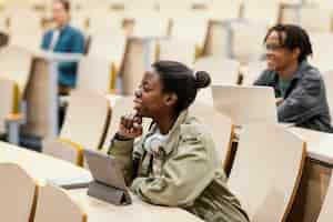 Free photo young students attending a university class