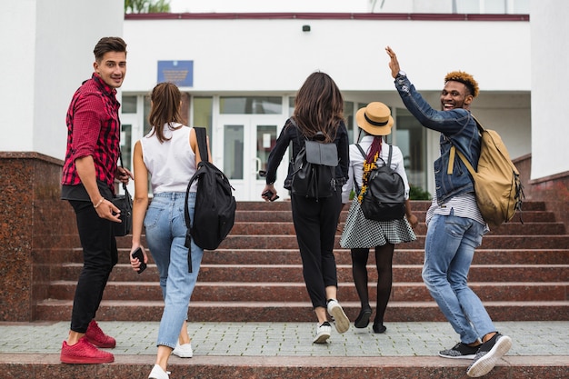 Young students walking up stairs