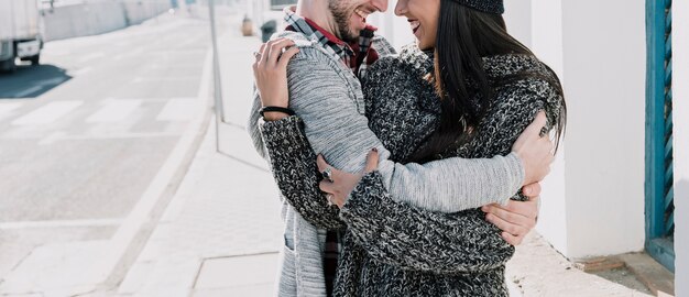 Young stylish couple hugging